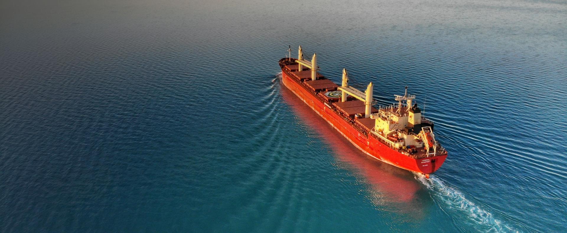 Freight Ship sailing in calm Ocean Waters